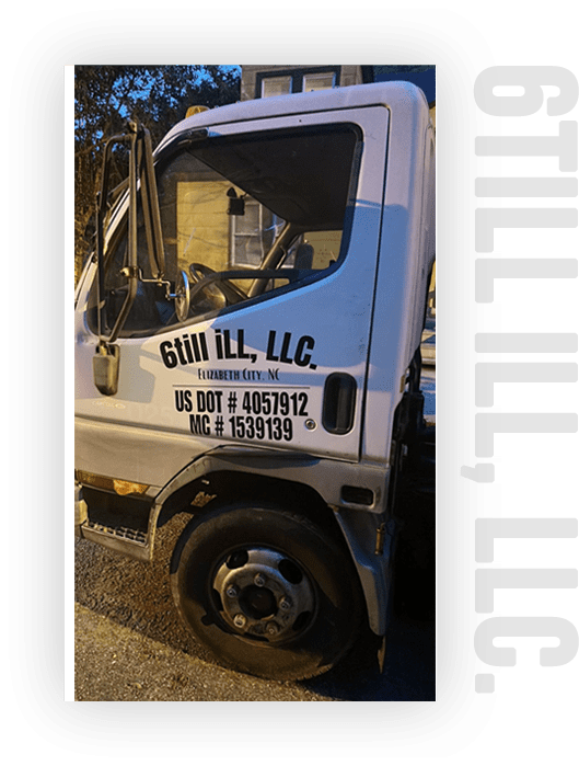 A white truck with the door open and the words " guil ll llc ".
